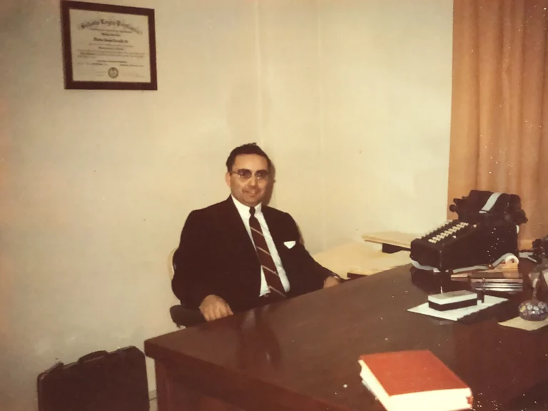 Attorney Martin J. Cicatelli seated at his desk in the Stoneham law office, circa 1967.