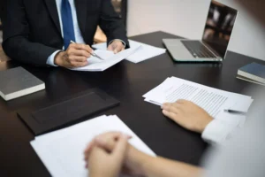 Attorney meeting with clients regarding Massachusetts legal practice areas